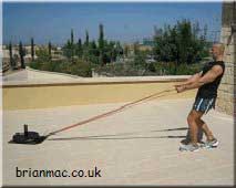 Power walking backwards using straps